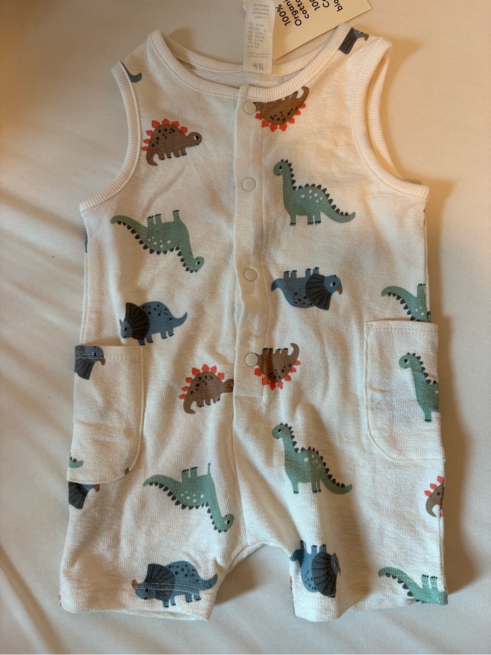 H&M organic cotton terry romper suit with dinosaur print, size 4-6m